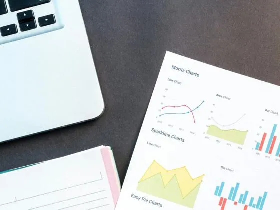 Statistics on a paper with a laptop